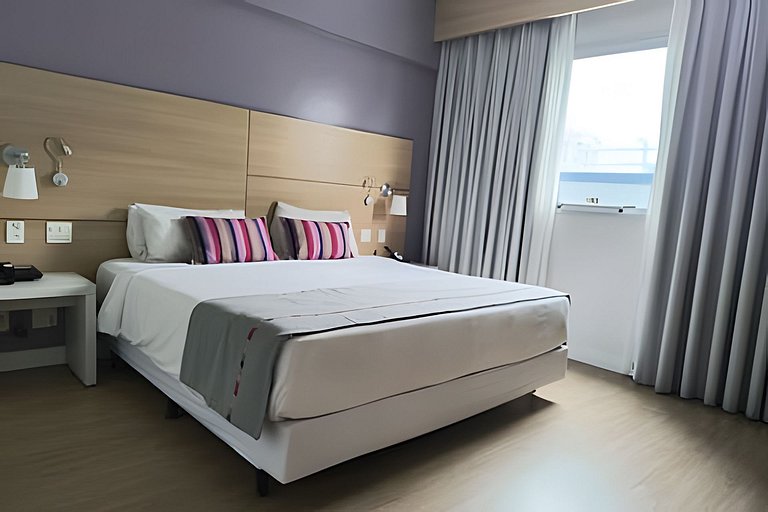 Suíte em flat no Gonzaga Stay Helbor