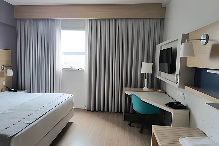 Suíte em flat no Gonzaga Stay Helbor