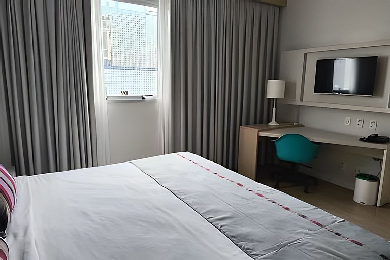 Suíte em flat no Gonzaga Stay Helbor