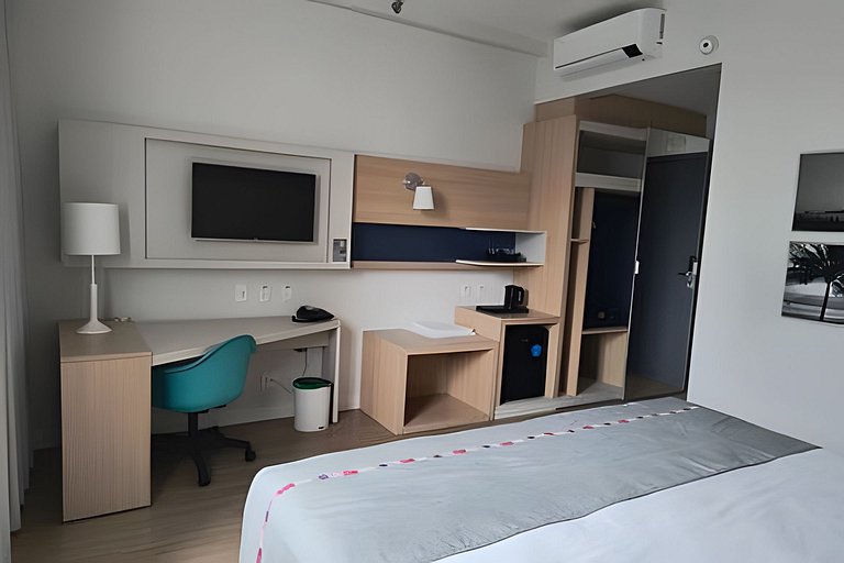 Suíte em flat no Gonzaga Stay Helbor